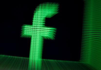 A 3D-printed Facebook logo is seen in front of displayed binary digits in this illustration taken March 18, 2018. REUTERS/Dado Ruvic/Illustration/File Photo
