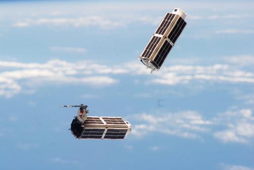 Two of Planet Labs imaging satellites are seen shortly after they were released from the International Space Station