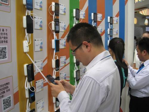Smartphones are displayed at an electronics show in Beijing