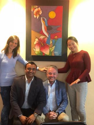 Stephen Lawrence with the other IBM’er team members in Ecuador:  Vania Doria of Brazil,  Vikram Tiwari of India; and Lilian Wu of  China. On the background is an artwork they bought for their client SENDAS, featuring the national bird of Ecuador, the hummingbird (photo taken from Stephen's blog)